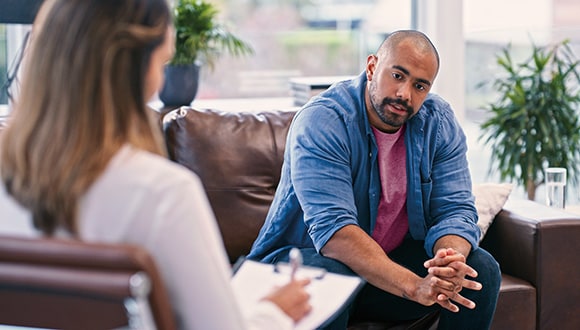 Man talking to a counsellor