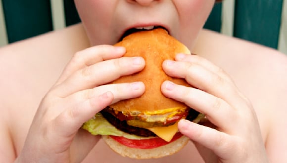 boy eating burger