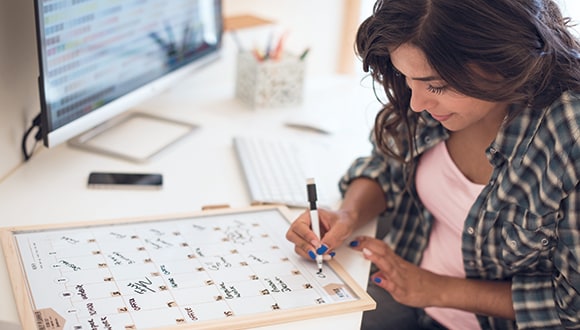 Women checking calendar for her private health insurance waiting periods