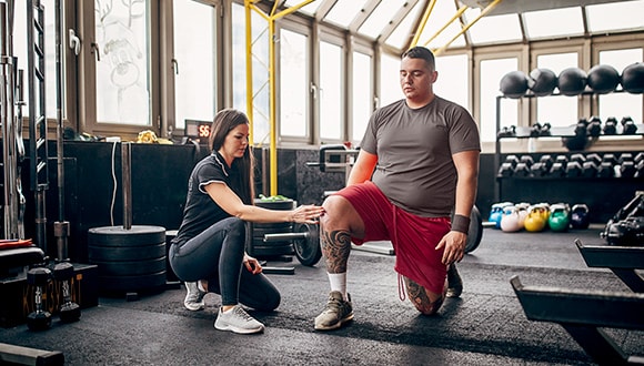 Man in the gym doing exercises