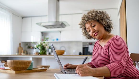 Woman in sitting at desk